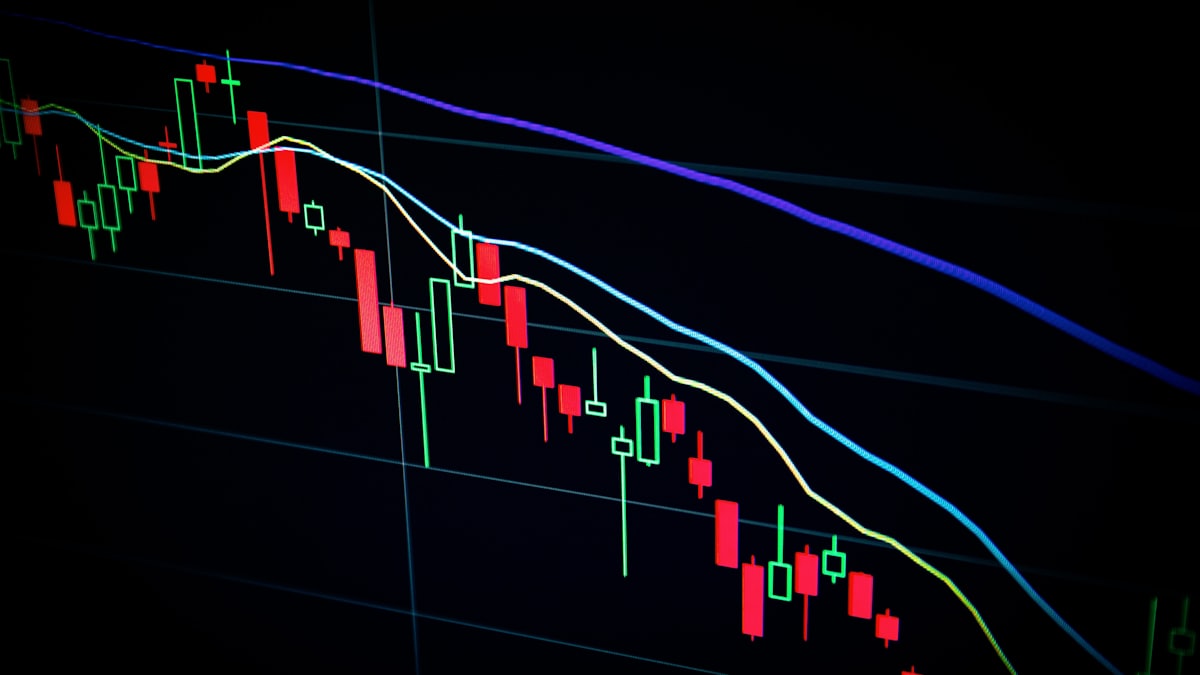 Candlestick trading chart on a dark screen